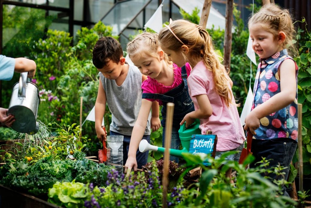 group-of-kindergarten-kids-learning-gardening-outdoors-1.jpg